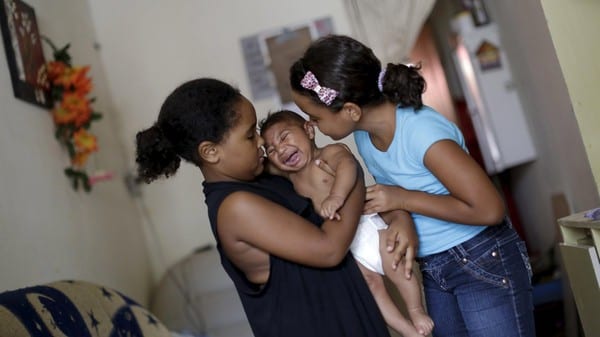 Maria Clara (L) And Camile Vitoria Hold Their Brother Matheus, Who Has Microcephaly, In Recife, Brazil, January 27, 2016. Health Authorities In The Brazilian State At The Center Of A Rapidly Spreading Zika Outbreak Have Been Overwhelmed By The Alarming Surge In Cases Of Babies Born With Microcephaly, A Neurological Disorder Associated To The Mosquito-Borne Virus. Reuters/Ueslei Marcelino